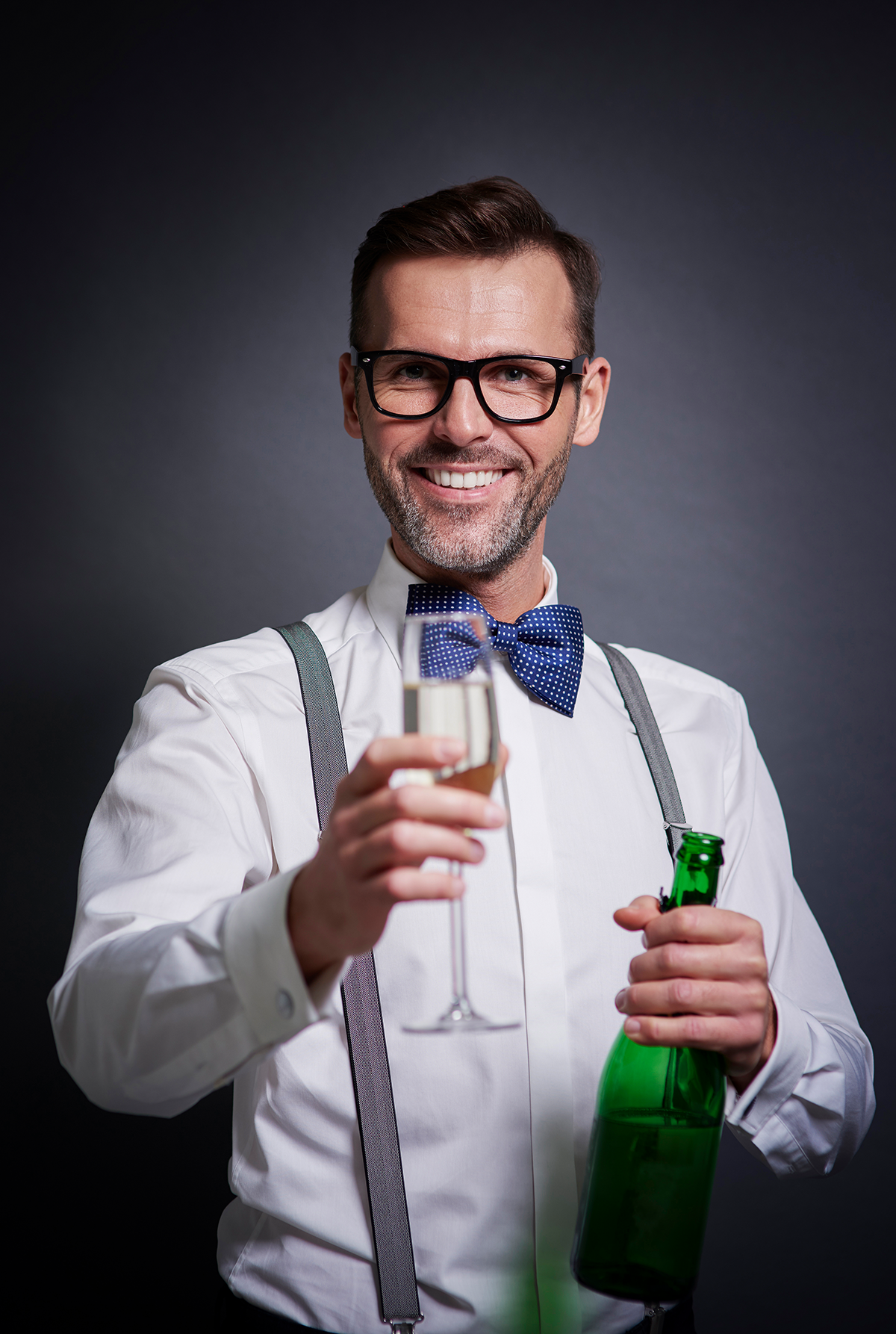 Elegant man with a bottle of champagne from Elite Alco